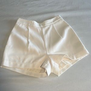Bebe high waisted 3” inseam off white shorts. 95% polyester 5% spandex.